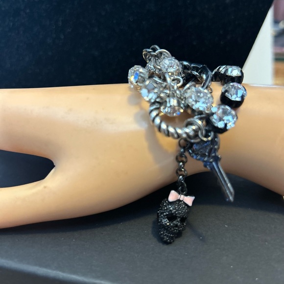 Betsey Johnson Chain/Charm bracelet
Silvertone/black/rhinestones 
Skull Key logo - Picture 5 of 11